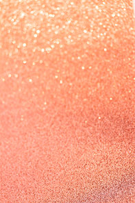 Christmas holiday living glittering defocused coral pink background with bokeh lights