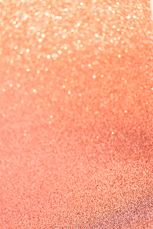 Christmas holiday living glittering defocused coral pink background with bokeh lights