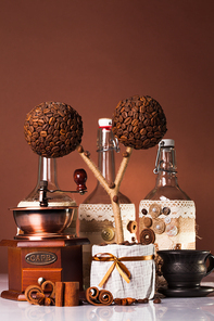 Bottles decorated with coffe beans, cinnamon and lace