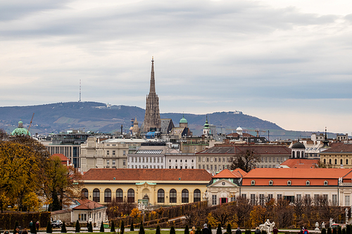 Wonderful cityscape with view of Unteres Belvedere complex and other historic buildings on a background of grey cloudy sky on autumn day in Vienna, Austria.