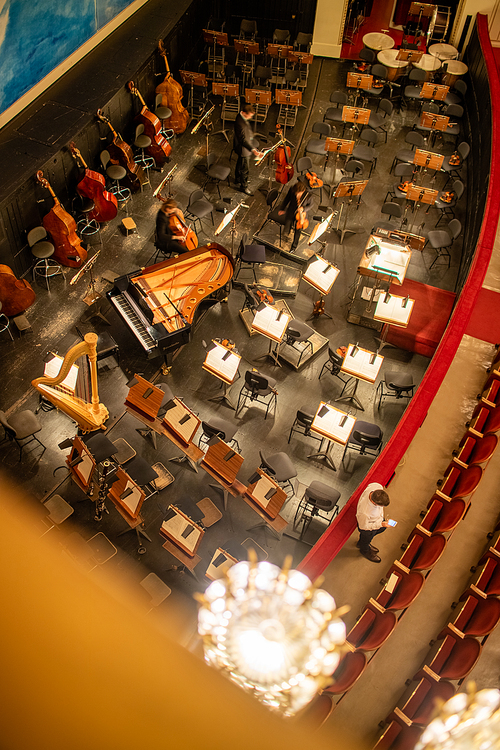 Top view to orchestra pit without musicians in the interior of the Vienna State Opera before starting performance in Vienna, Austria.