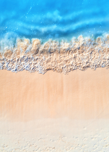 aerial view of clear blue sea with waves and empty white sandy beach at . summer in zanzibar, africa. tropical landscape with white sand and azure water. ocean. top view. nature background