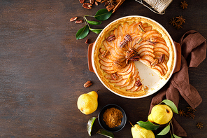 Pear tart, pie or cake with fresh pears, cinnamon and pecan nuts