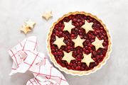 Homemade cherry pie, tart with star shaped cookies