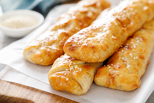 Freshly baked homemade savory puff pastries patties, rollini