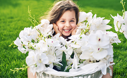 Pretty cute daughter holding a flower basket