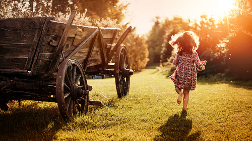 Portrait of a little, cute girl on a farm
