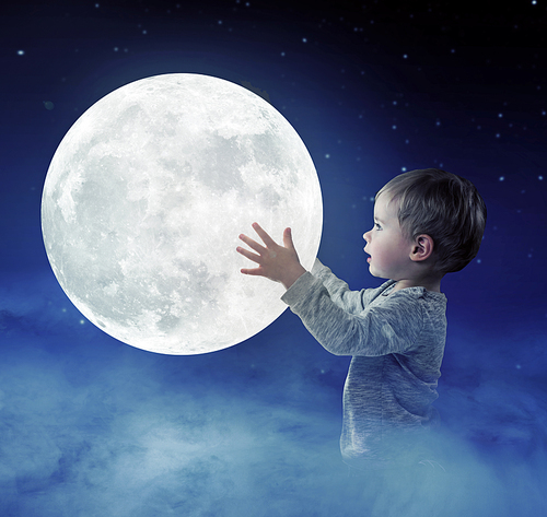 Art portrait of a cute, little boy holding a moon