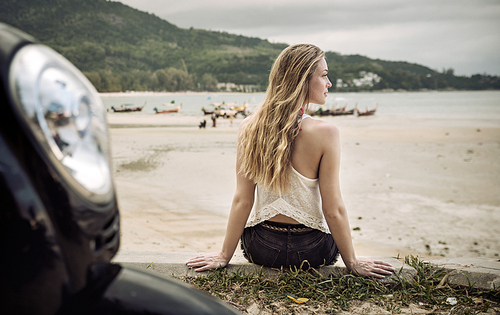 Sensual young woman enjoying summer on a tropical beach