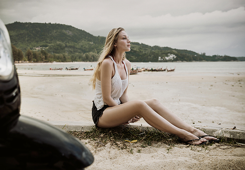 Sensual young woman enjoying summer on a tropical beach