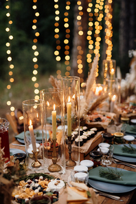atmospheric candle decor with live fire on the banquet table