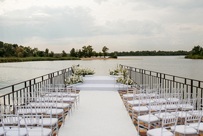 area for the wedding ceremony, on a stone pier near the water