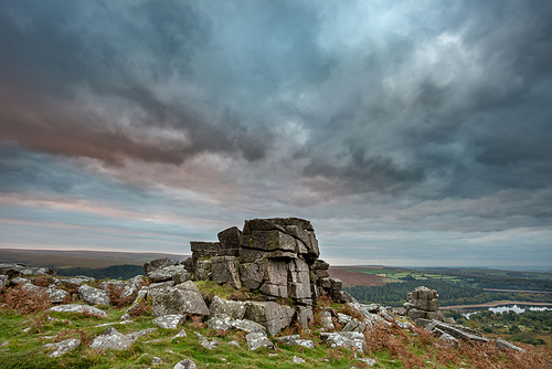 Beautiful Autumn sunset landscape image of view from Leather Tor in Dartmoor National Park
