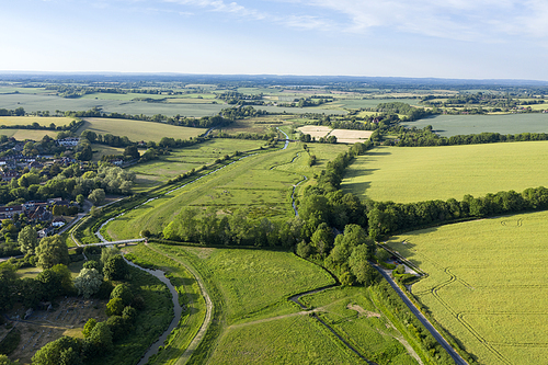 Stunning drone landscape image over lush green Summer English countryside during late afternoon light