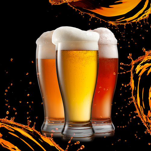 Different beer in glasses with splash isolated on black background