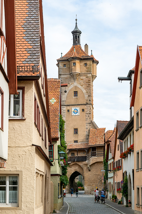 Rothenburg ob der Tauber, Bavaria / Germany - 23 July 2020: a view of one of the many city gate guard towers in the medieval Bavarian city of Rothenburg ob der Tauber