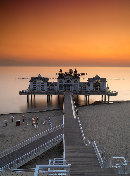 Sellin, M-V / Germany - 15 August 2020: vertical view of the Sellin Pier on the Baltic Sea at sunrise