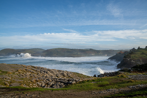 A view of huge waves crashing onto the shores of Cabo de Ajo on the northern Spanish coast