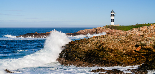 A view of the lighthouse on Isla Pancha in Galicia