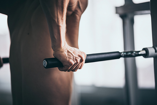 young fitness person execute exercise with exercise-machine in gym