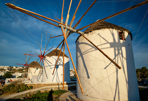 Scenic view of famous Mykonos Chora town windmills. Traditional greek windmills on Mykonos island at sunrise. Cyclades, Greece