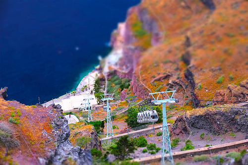 Tourist cable car lift in Fira on Santorini island, Greece. Toy camera tilt shift miniature effect