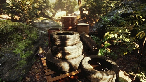 old used wheels in the tropical forest as pollution concept