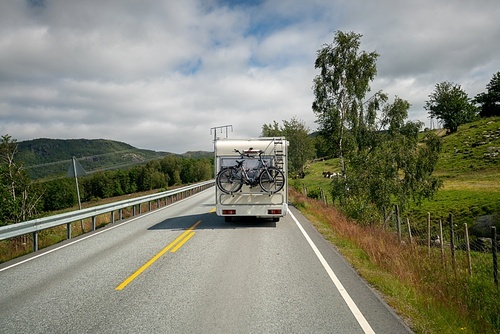VR Caravan car travels on the highway. Tourism vacation and traveling. Beautiful Nature Norway natural landscape.