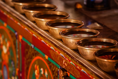 Offerings (Tibetan Water Offering Bowls) in Likir gompa (Tibetan Buddhist monastery). Ladakh, India