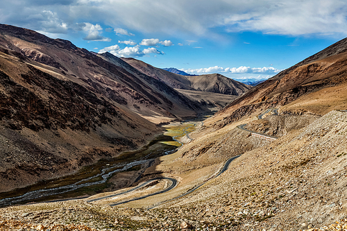 View of valley with road near Tanglang la Pass - mountain pass in Himalayas along the Leh-Manali highway. Ladakh, India