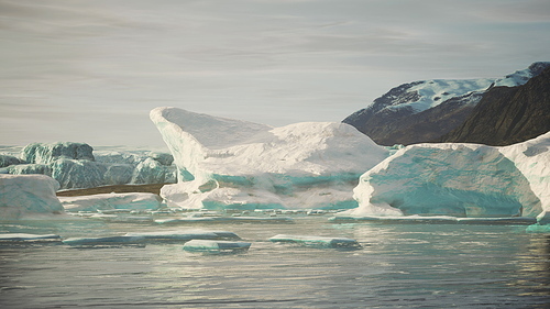 snow-capped mountains against the blue ocean in Antarctica