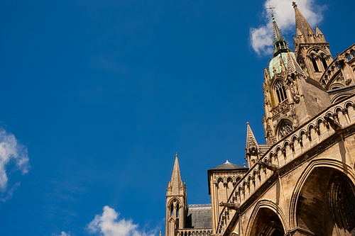 The spires of The Cathedral of Our Lady of Bayeux, Normandy, France, Europe with a blue sky