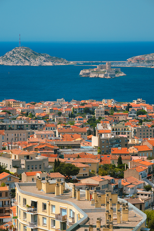 View of Marseille town and Chateau d'If castle famous historical fortress and prison on island in Marseille bay. Marseille, France
