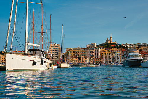 Marseille Old Port (Vieux-Port de Marseille) with yachts and Basilica of Notre-Dame de la Garde. Marseille, France