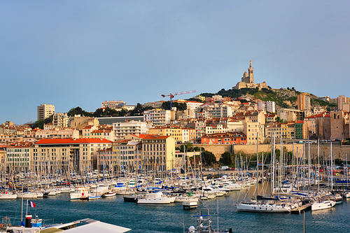 Marseille Old Port (Vieux-Port de Marseille) with yachts and Basilica of Notre-Dame de la Garde. Marseille, France
