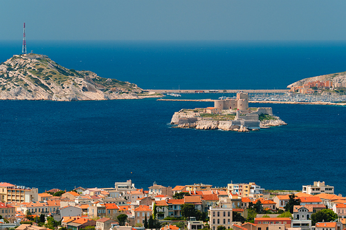 View of Marseille town and Chateau d'If castle famous historical fortress and prison on island in Marseille bay. Marseille, France