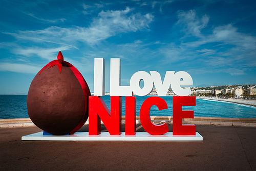 I love Nice in Easter style with chocloate egg with Nice town and beach in background. Nice, France