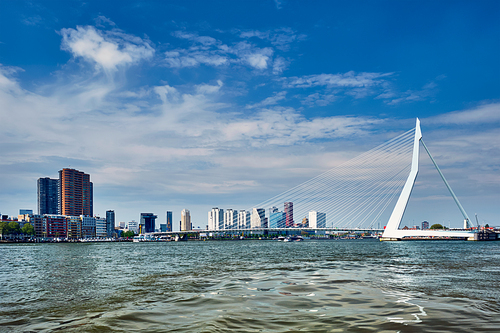 View of Rotterdam skyline over Nieuwe Maas with Erasmusbrug bridge and skyscrapers. Rottherdam, the Netherlands