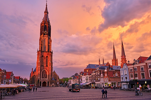 Nieuwe Kerk New Church protestant church on Delft Market Square Markt with dramatic sky on sunset. Delft, Netherlands