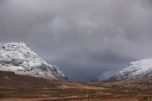 Stunning dramatic landscape Winter image of iconic Stob Dearg Buachaille Etive Mor mountain in Scottish Highlands