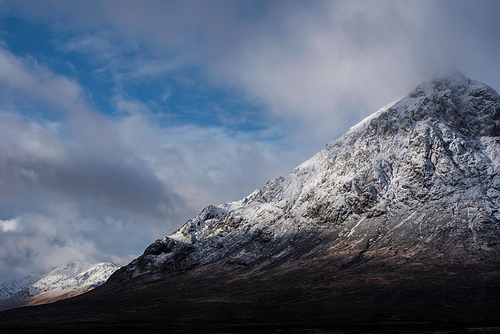 Stunning iconic landscape Winter image of Stob Dearg Buachaille Etive Mor mountain in Scottish Highlands