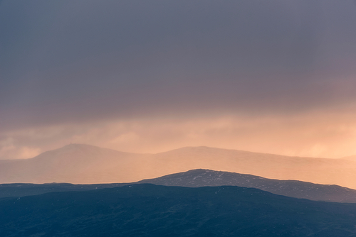 Stunning Winter landscape image of view along Rannoch Moor during heavy rainfall giving misty look to the scene