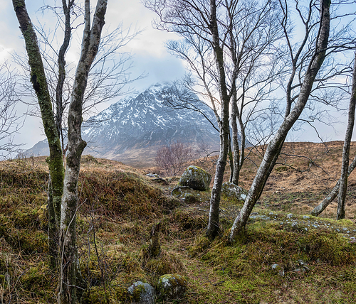 Beautiful landscape Winter portrait ofn Stob Dearg Buachaille Etive Mor mountain and snowcapped peak in Scottish Highlands