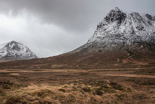 Stunning dramatic landscape Winter image of iconic Stob Dearg Buachaille Etive Mor mountain in Scottish Highlands