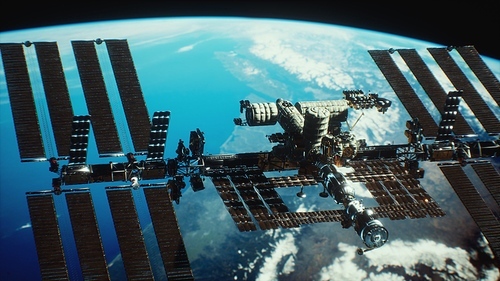 International Space Station over the planet earth. Elements of this image furnished by NASA