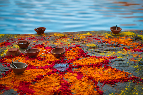 Oil Lamp Pooja Diya Lamp and kumkum powder flower and on ghats after pooja in Jodhpur, Rajasthan, India