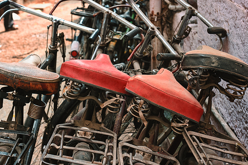 Bicycle saddles close up in Indian street. Jodhpur, Rajasthan, India