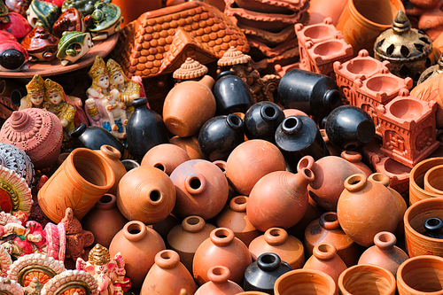 Street market exhibition of handmade clay pots, ceramic, products and souvenirs. Udaipur, Rajasthan, India