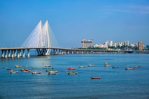 Mumbai skyline Bandra - Worli Sea Link bridge with fishing boats view from Bandra fort. Mumbai, Maharashtra, India