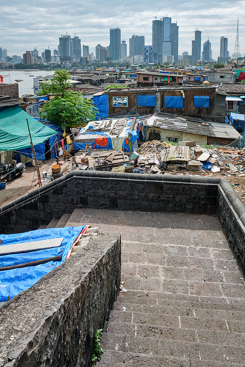 View of Mumbai skyline with skyscrapers over slums in Bandra suburb. Mumbai, Maharashtra, India